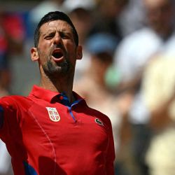 El serbio Novak Djokovic reacciona tras vencer al alemán Dominik Koepfer durante su partido de tenis en el Estadio Roland-Garros durante los Juegos Olímpicos. Foto de CARL DE SOUZA / AFP | Foto:AFP