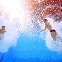 Una vista submarina muestra a Lorenzo Marsaglia y Giovanni Tocci de Italia compitiendo en la final de saltos sincronizados de trampolín. Foto de Oli SCARFF / AFP | Foto:AFP