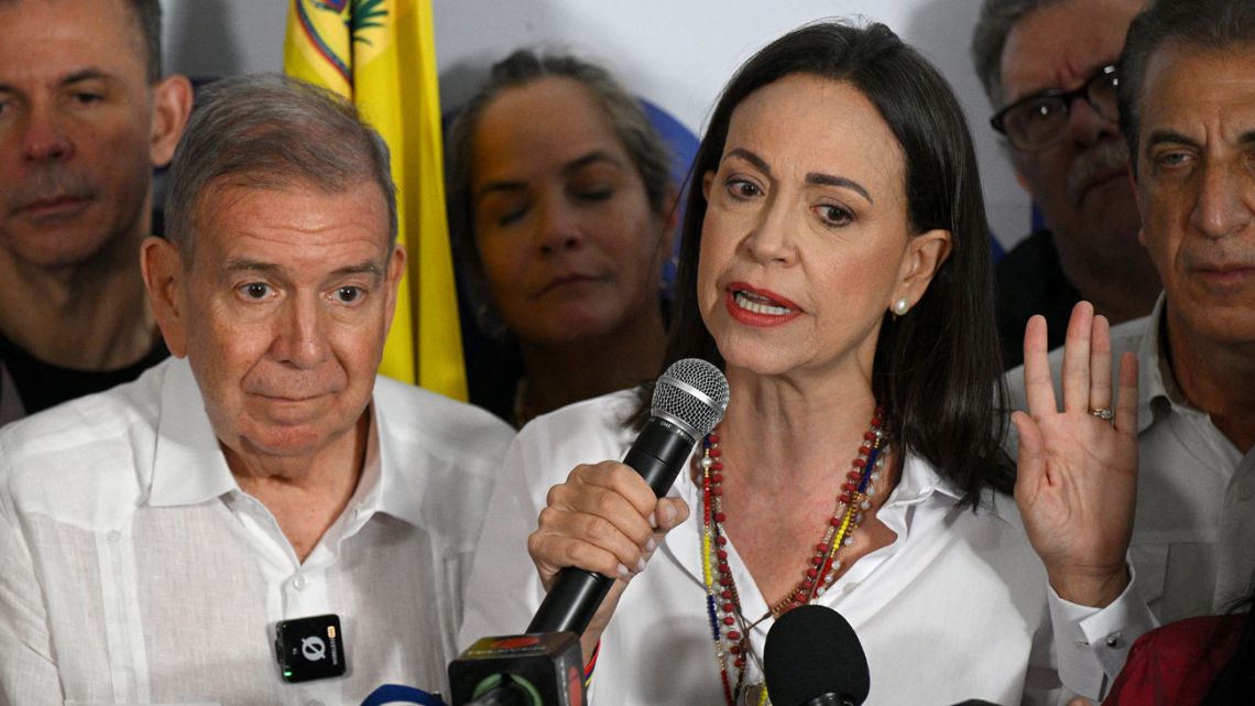 Venezuelan opposition leader María Corina Machado talks to the media, accompanied by opposition presidential candidate Edmundo González Urrutia.