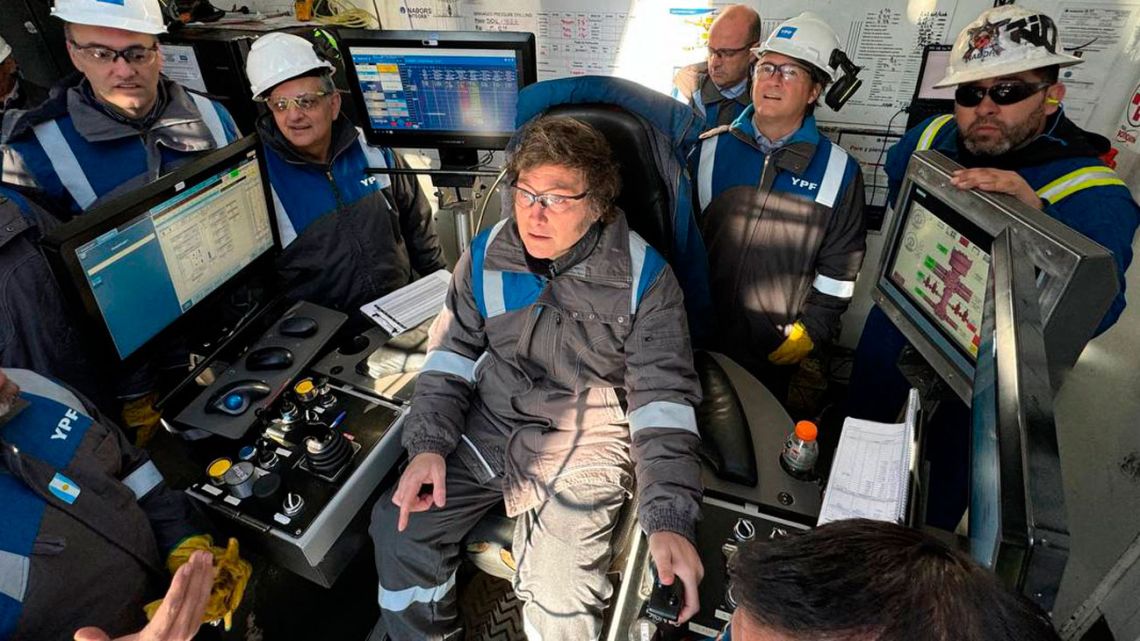 This handout picture released by the Presidency shows President Javier Milei operating equipment of state-owned oil company YPF (Yacimientos Petroliferos Fiscales) during a visit at Vaca Muerta oilfield near Añelo, Neuquén Province, on August 8, 2024. 
