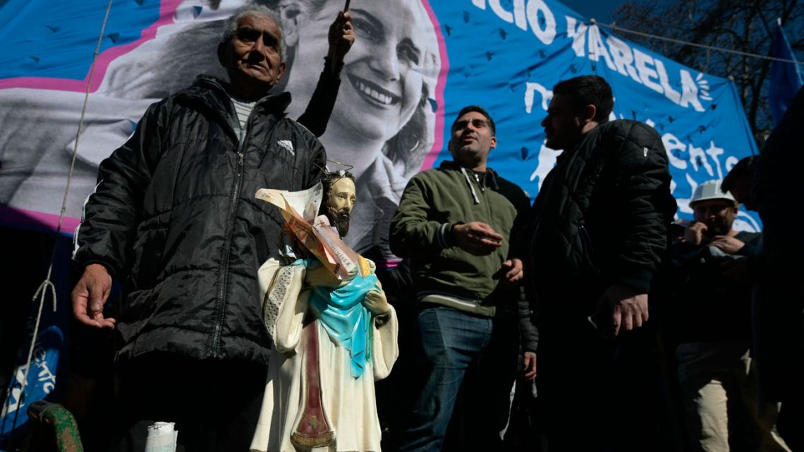 An image of San Cayetano is seen on a wheelbarrow at Plaza de Mayo Square during a protest against Argentine President Javier Milei's government in Buenos Aires on August 7, 2024. Every year on its day, San Cayetano, the patron saint of work and bread, attracks thousands of faithful Catholics looking for employment. 