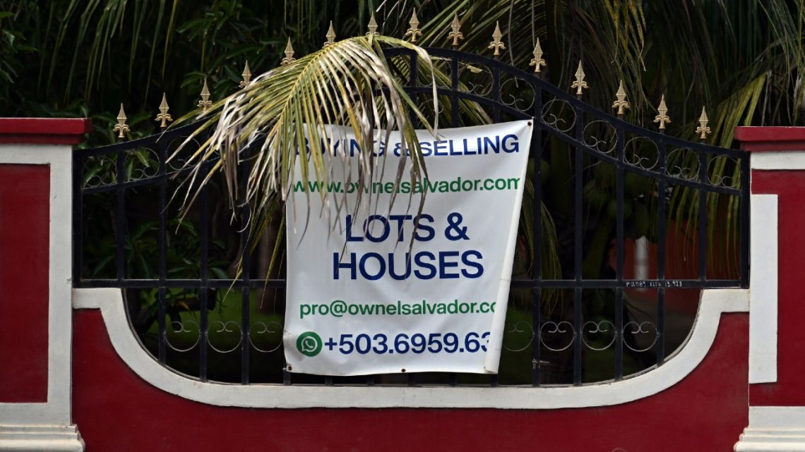 A sign advertising property in El Salvador.