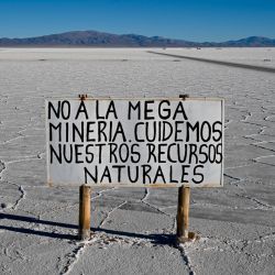 A sign reading: 'No to mega-mining. Let's take care of natural resources,' is seen at Salinas Grandes salt flat, Jujuy province, Argentina on July 2, 2024.