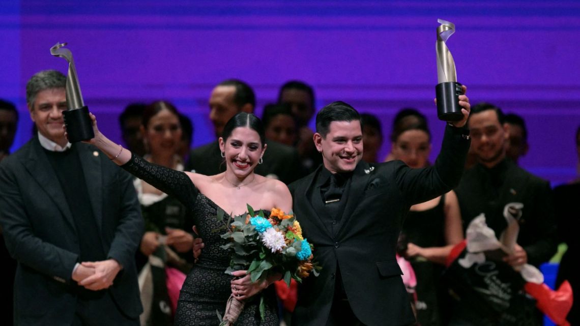 Winners of the Saloon Tango Style category, Fatima Caracoch (L) and Lucas Brenno Marquez, celebrate after the World Tango Championship Final in Buenos Aires on August 27, 2024. 