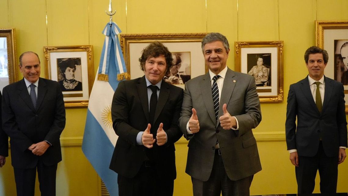 Buenos Aires City Mayor Jorge Macri and President Javier Milei mark the signing of an agreement transferring responsibility for more than 30 bus-lines to City Hall.