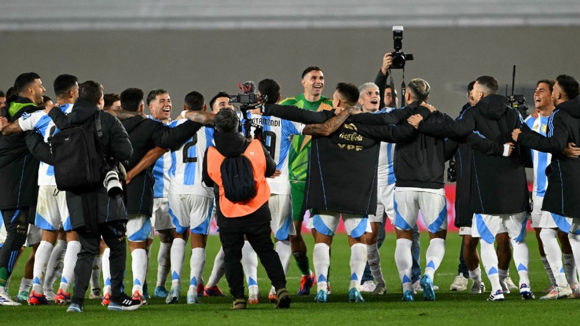 Argentina players celebrate their victory at the end of the 2026 FIFA World Cup South American qualifiers football match between Argentina and Chile at the Mas Monumental stadium in Buenos Aires on September 5, 2024. 