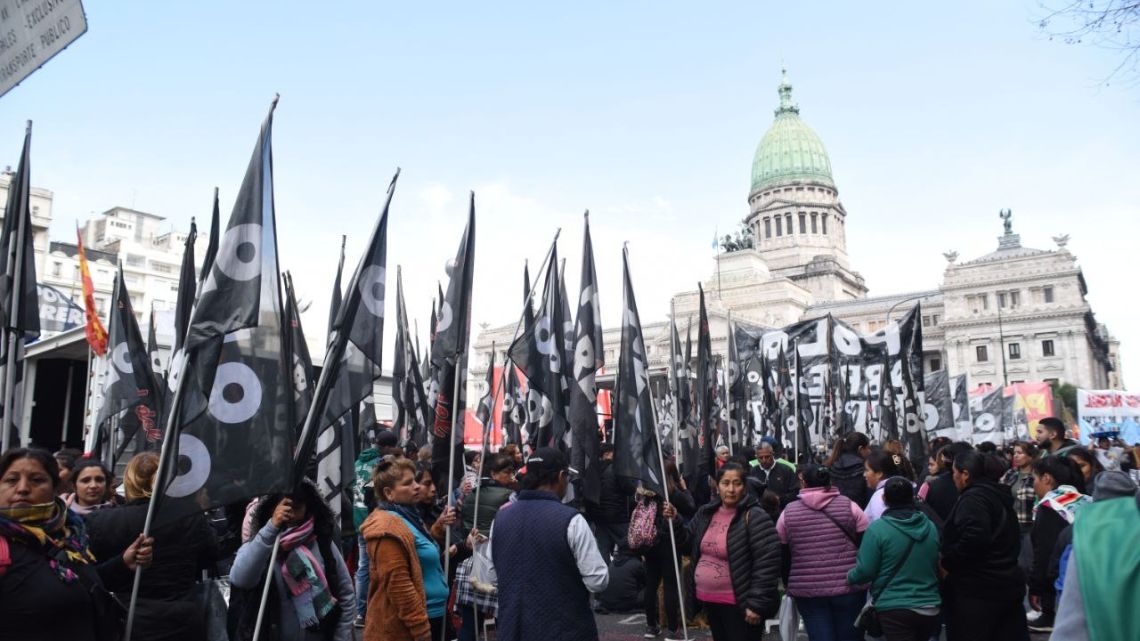 Demonstrators congregate outside Congress.