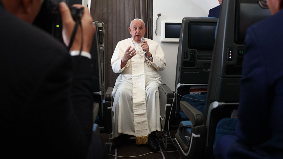 Pope Francis holds a press conference aboard the papal plane on his flight back after his 12-day journey across Southeast Asia and Oceania, on September 13, 2024. 