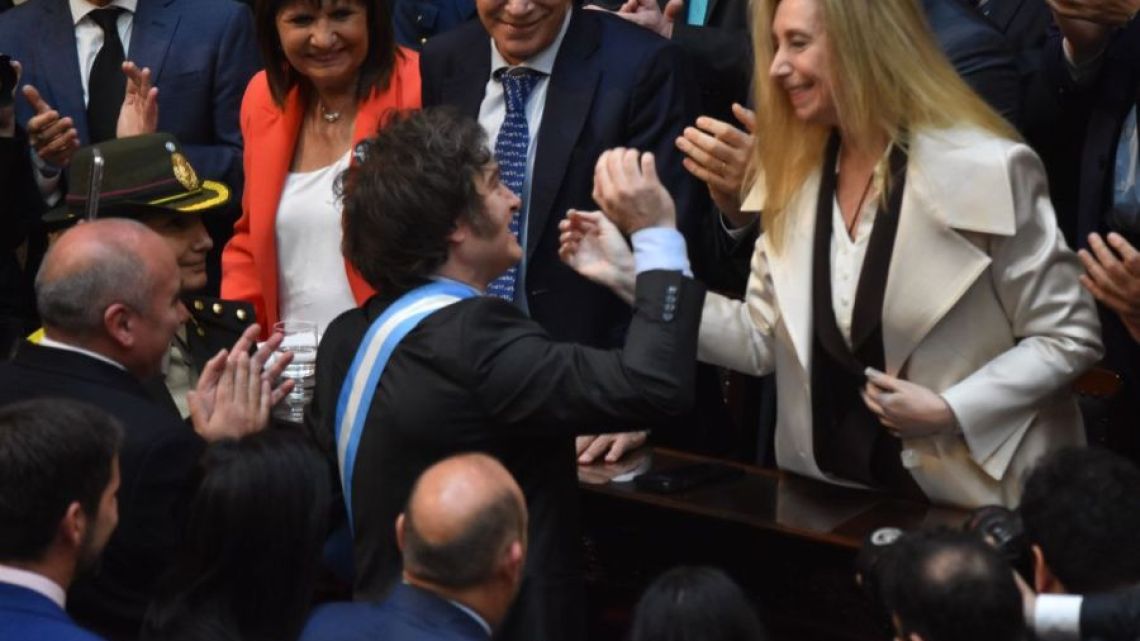 President Javier Milei greets his sister, presidential chief-of-staff Karina Milei, before his 2024 Budget bill speech to Congress.