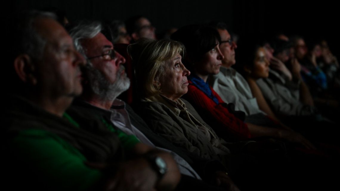 People watch the film 'Traslados,' directed by Argentine Nicolás Gil Lavedra in Buenos Aires on September 17, 2024.