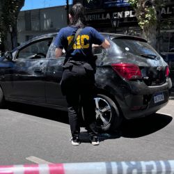 Police officers check on an assault and robbery in Rosario, Santa Fe Province, Argentina on November 22, 2023. 