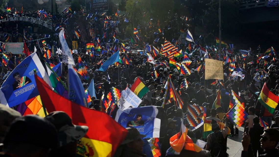 Supporters of former Bolivian President Evo Morales wait for his arrival during a rally against President Luis Arce in La Paz on September 23, 2024. 