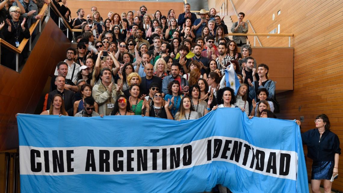 Representatives of Argentine films presented at the 72nd edition of the San Sebastián International Film Festival hold a banner reading ‘Argentine cinema identity’ as they take part in a protest to support the film industry on September 24, 2024.