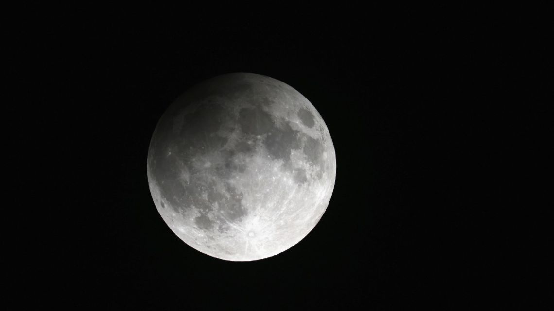 A general view of the moon during a partial lunar eclipse as well as the annual Harvest Moon on September 15, 2024 in New York, New York.