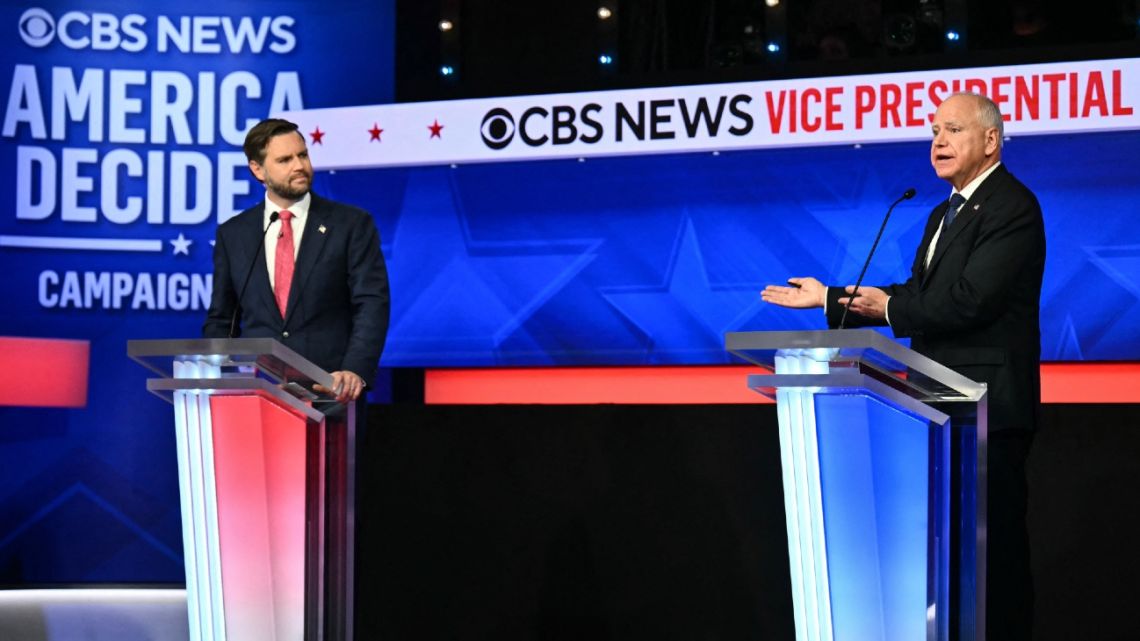 US Senator and Republican vice presidential candidate J.D. Vance (L) and Minnesota Governor and Democratic vice presidential candidate Tim Walz participate in the Vice Presidential debate hosted by CBS News at the CBS Broadcast Center in New York City on October 1, 2024.