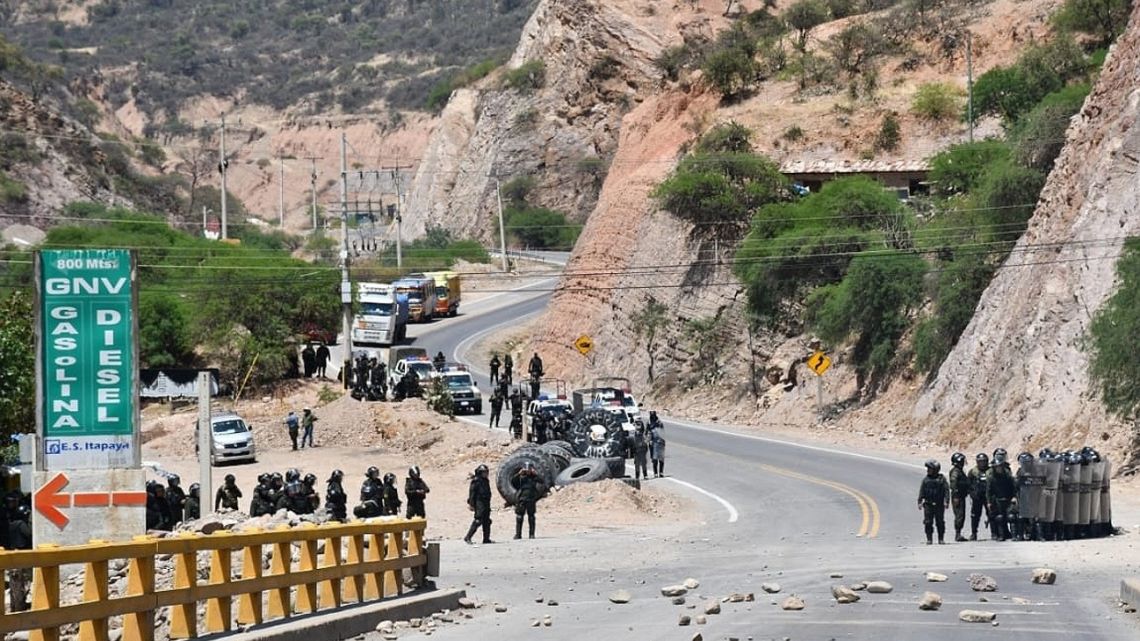 In this photo released by Radio Kawsachun Coca (RKC) supporters of Bolivia's former President Evo Morales clash with riot police during a road blockade in Parotani, Bolivia, on October 14, 2024. 