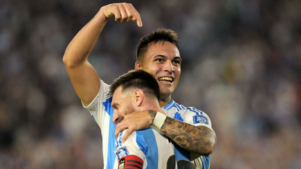 Argentina's forward Lautaro Martínez celebrates with Lionel Messi after scoring during the 2026 FIFA World Cup South American qualifiers football match between Argentina and Bolivia at the Mas Monumental stadium in Buenos Aires on October 15, 2024. 