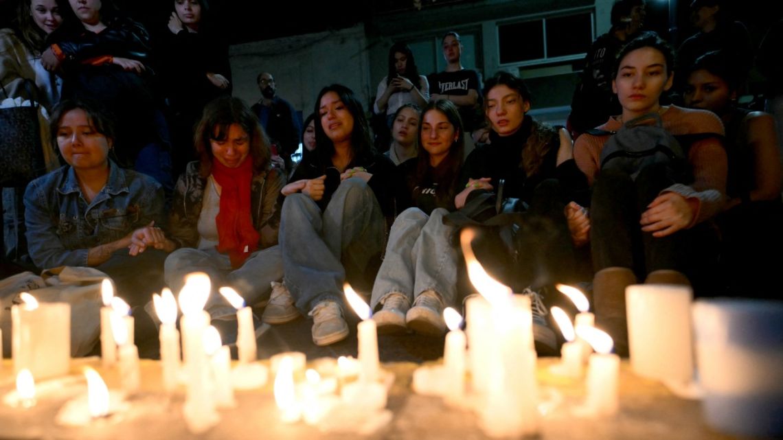 Fans of British singer Liam Payne lit candles next to the hotel where he died in Buenos Aires on October 16, 2024. 