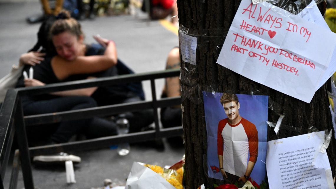 Fans pay tribute to British singer Liam Payne in front of the hotel where he died in Buenos Aires on October 17, 2024. Tributes poured in Thursday for British singer Liam Payne, a former member of the best-selling boy band One Direction, after he plunged to his death from the balcony of a Buenos Aires hotel. 