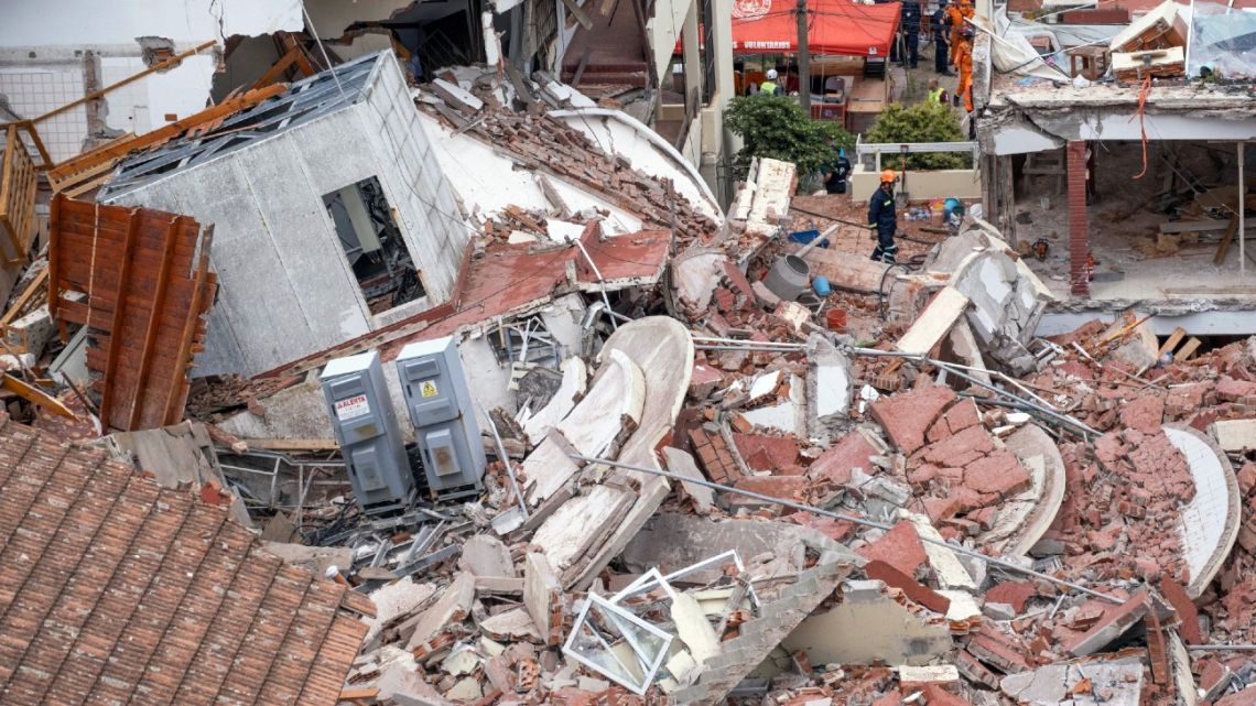 Rescuers search for missing people after the collapse of the Hotel Dubrovnik in the seaside resort of Villa Gessell, Buenos Aires Province, on October 29, 2024. 