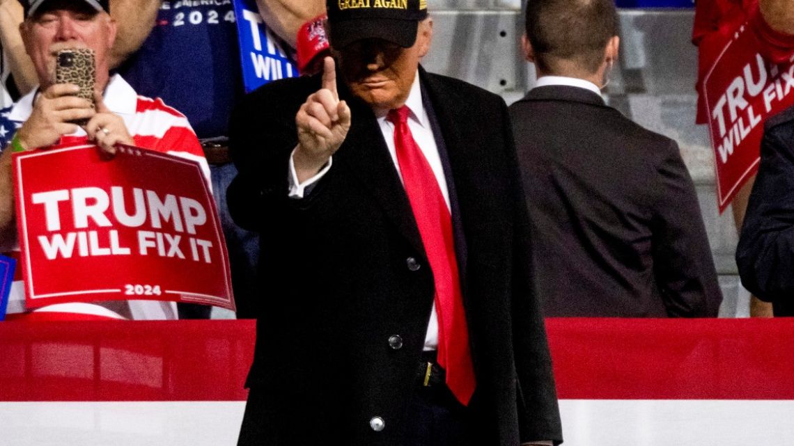 Former US President Donald Trump arrives for a campaign event at Atrium Health Amphitheater in Macon, Georgia