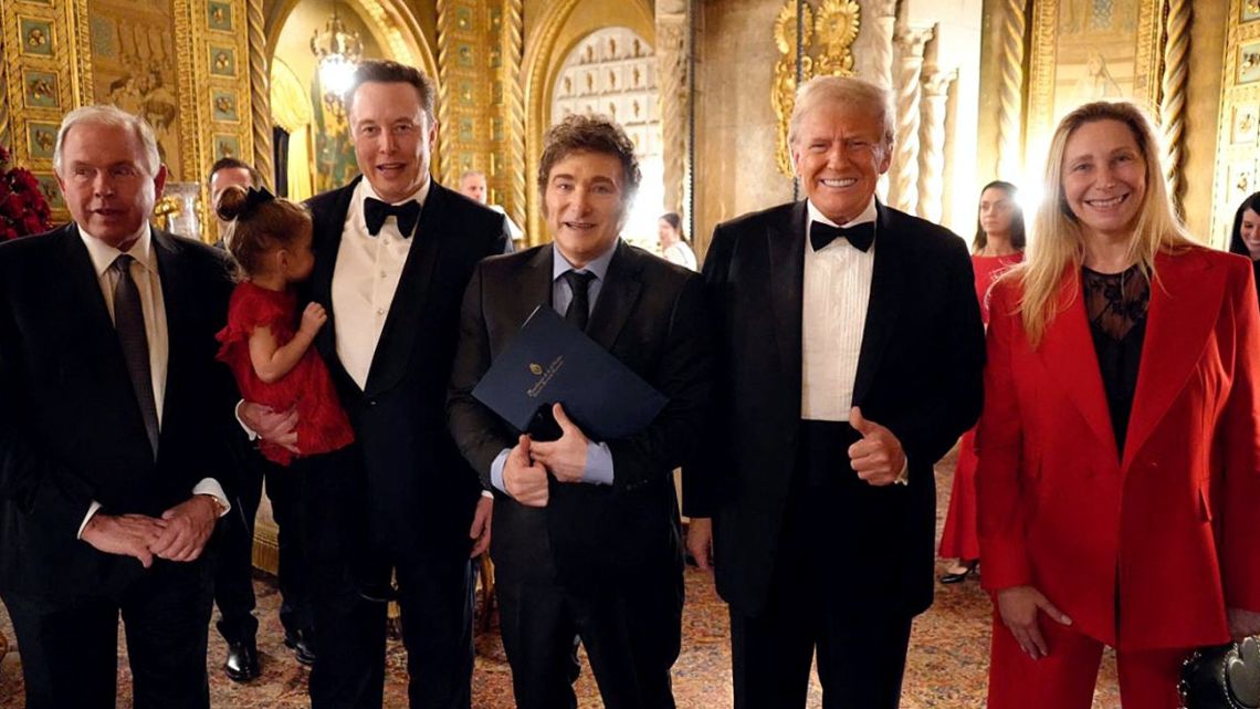 Handout picture released by the Presidency shows Foreign Minister Gerardo Werthein, Tesla and SpaceX CEO Elon Musk, Argentina's President Javier Milei, US President-elect Donald Trump, and Argentina's Presidential Chief-of-Staff Karina Milei posing for a picture at Mar-a-Lago in Palm Beach, Florida, on November 14, 2024.