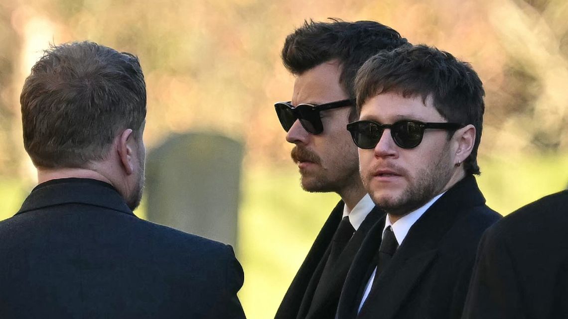 Former One Direction band members Harry Styles (C) and Niall Horan leave after attending the funeral service of the late One Direction singer Liam Payne, at a St Mary's church in Amersham, west of London on November 20, 2024. 