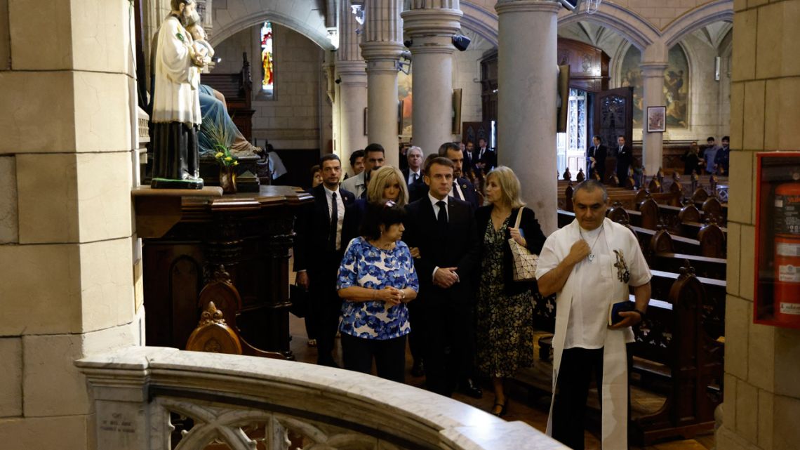 France's President Emmanuel Macron and his wife, Brigitte Macron, attend a wreath-laying ceremony in tribute to the victims of Argentina's 1976-1983 dictatorship at the Santa Cruz Church in Buenos Aires on November 17, 2024. 