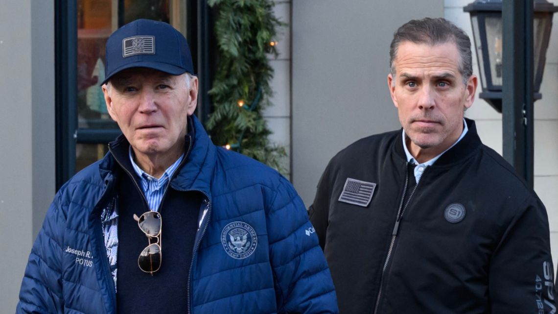 A November 29, 2024 photo shows US President Joe Biden and son Hunter Biden stepping out of a bookstore while shopping in Nantucket, Massachusetts on November 29, 2024