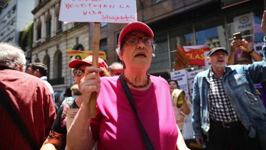 Alicia Ceresoli, an 80-year-old pensioner, protests outside the PAMI headquarters, the agency that manages retiree benefits, in Buenos Aires on December 4, 2024. 