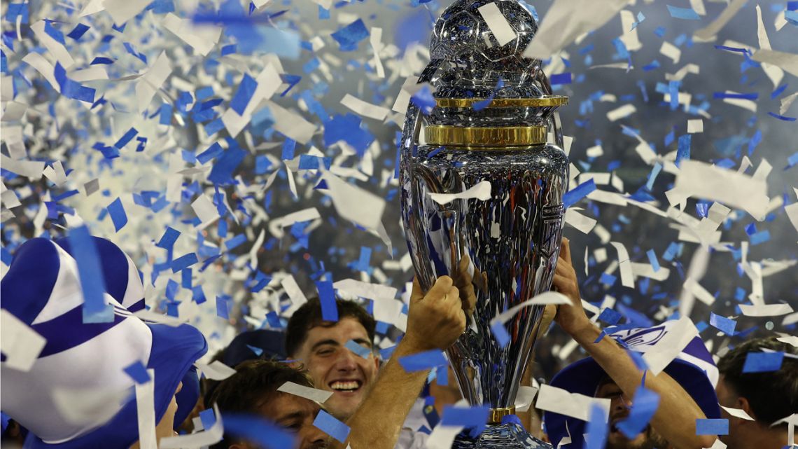 Vélez Sarfield players celebrate with the trophy after winning the Liga Profesional de Fútbol title at the José Amalfitani stadium in Buenos Aires on December 15, 2024. 