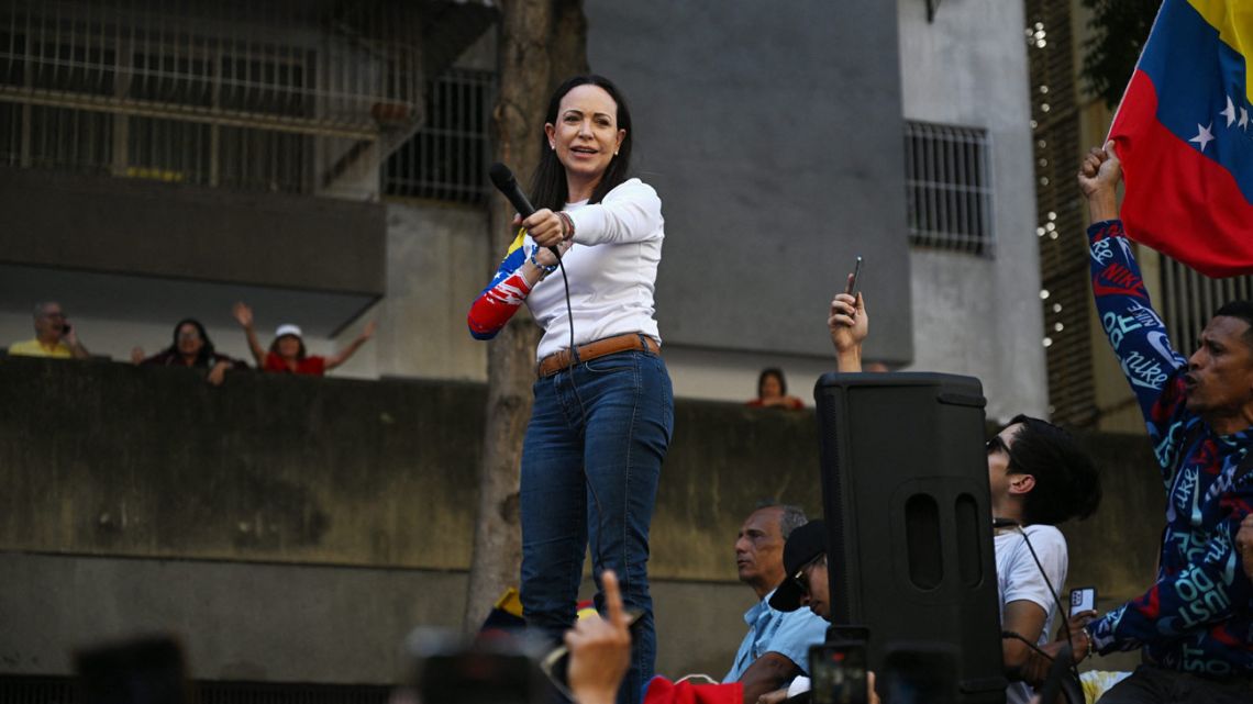 Venezuelan opposition leader María Corina Machado addresses supporters during a protest called by the opposition on the eve of the presidential inauguration, in Caracas on January 9, 2025. 