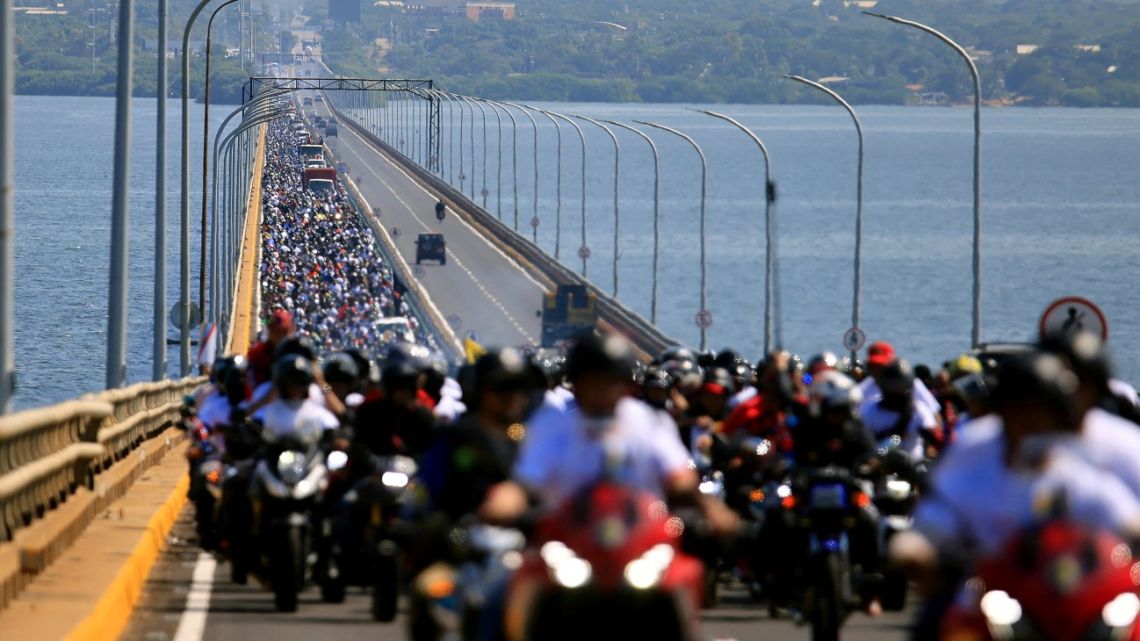 Supporters of Venezuela's President Nicolás Maduro ride motorcycles as they take part in a rally on the eve of the presidential inauguration in Maracaibo, Zulia State, Venezuela on January 9, 2025.