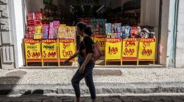 A shopper passes a store in Rio de Janeiro, Brazil