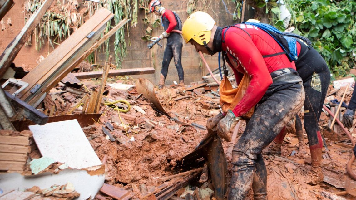 Firefighters work on a landslide site at Bethania neighbourhood, Ipatinga, Minas Gerais state, Brazil on January 12, 2025.