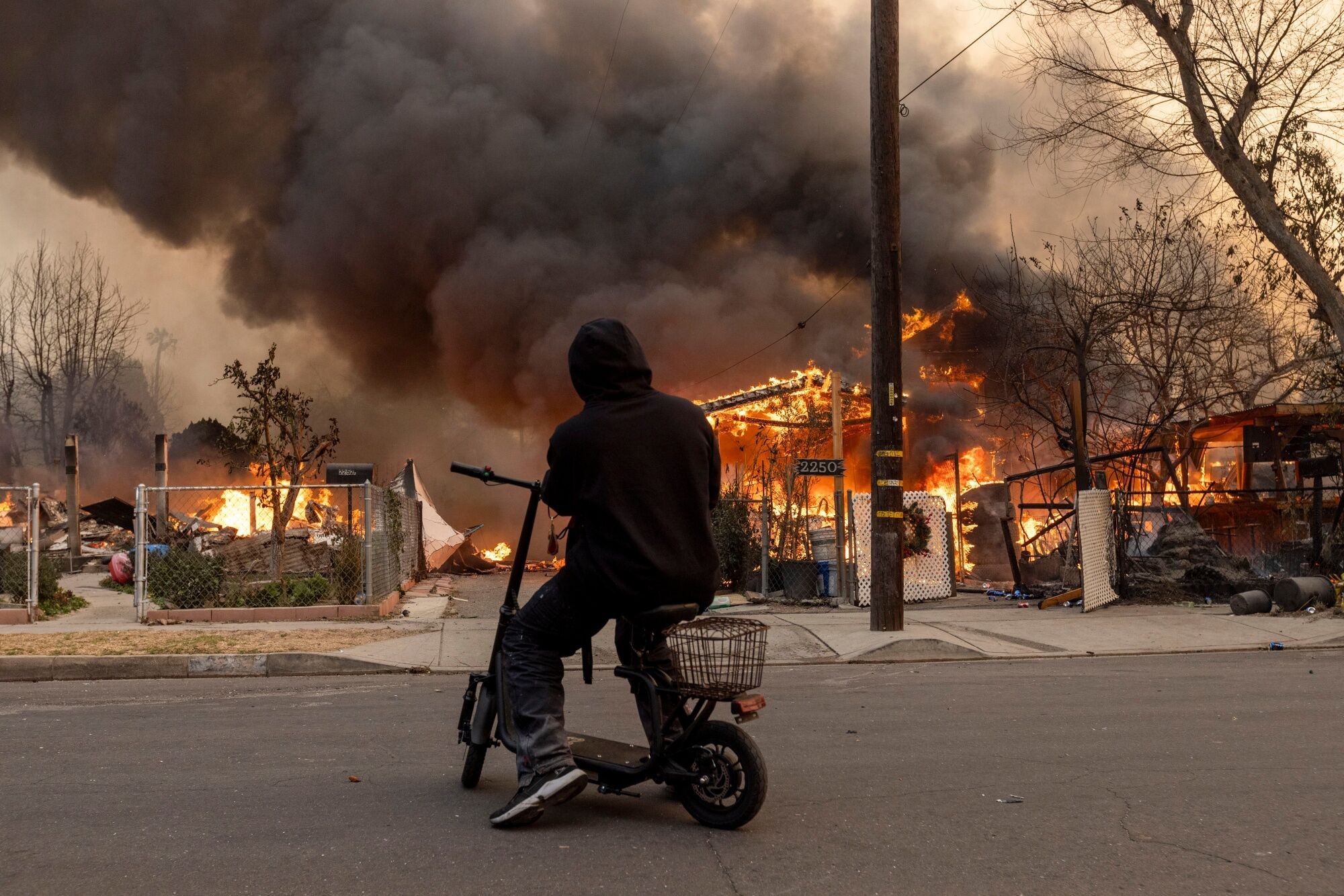 Thousands Flee From Uncontrolled Wildfires Burning Near LA