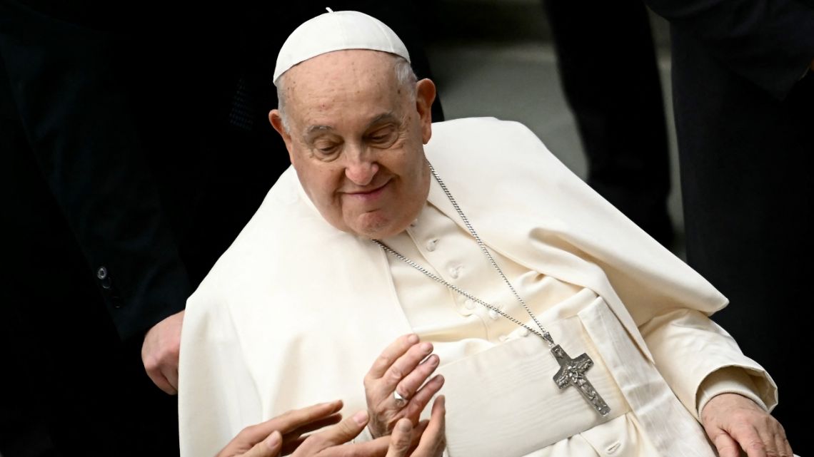 Pope Francis is acknowledged by faithfuls as he holds the weekly general audience in the Paul VI hall at the Vatican on January 15, 2025.