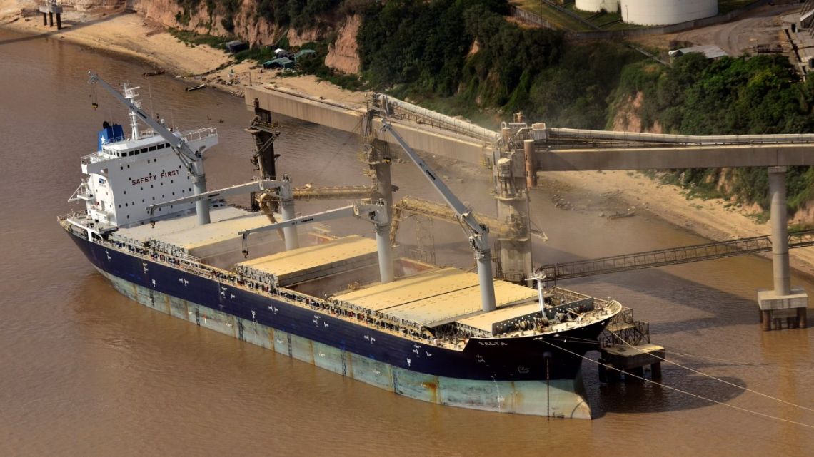 A ship is loaded at the Port of Rosario on the Paraná River in Rosario.