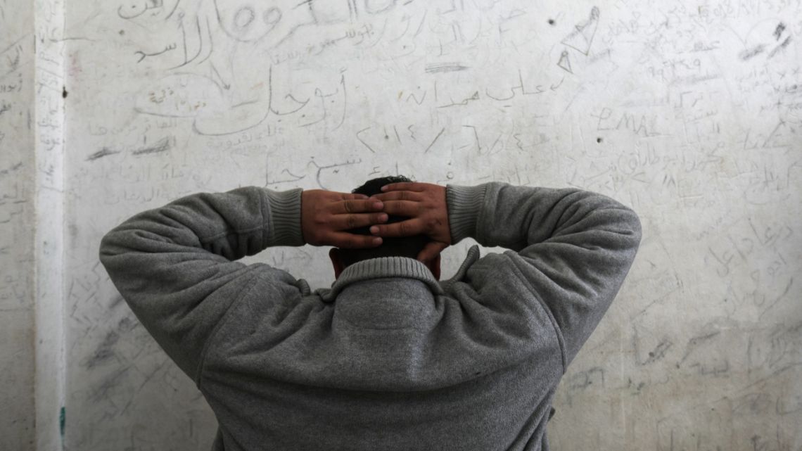 Former detainee in Saydnaya Omar al-Masri revisits a cell at a facility which was used as a jail for the Tishreen Military Hospital, currently out of service, in Damascus on January 10, 2025.