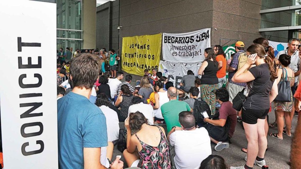 Employees of the CONICET scientific research institute stage a workers' assembly.