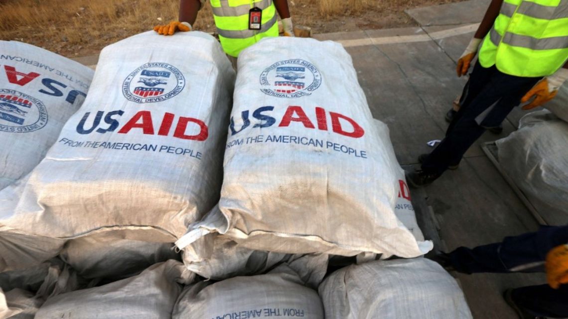 Airport personnel check humanitarian aid supplies after 60 tons of aid from USAID were unloaded from a plane at the airport in Arbil, the capital of the autonomous Kurdish region of northern Iraq, on September 2, 2014.