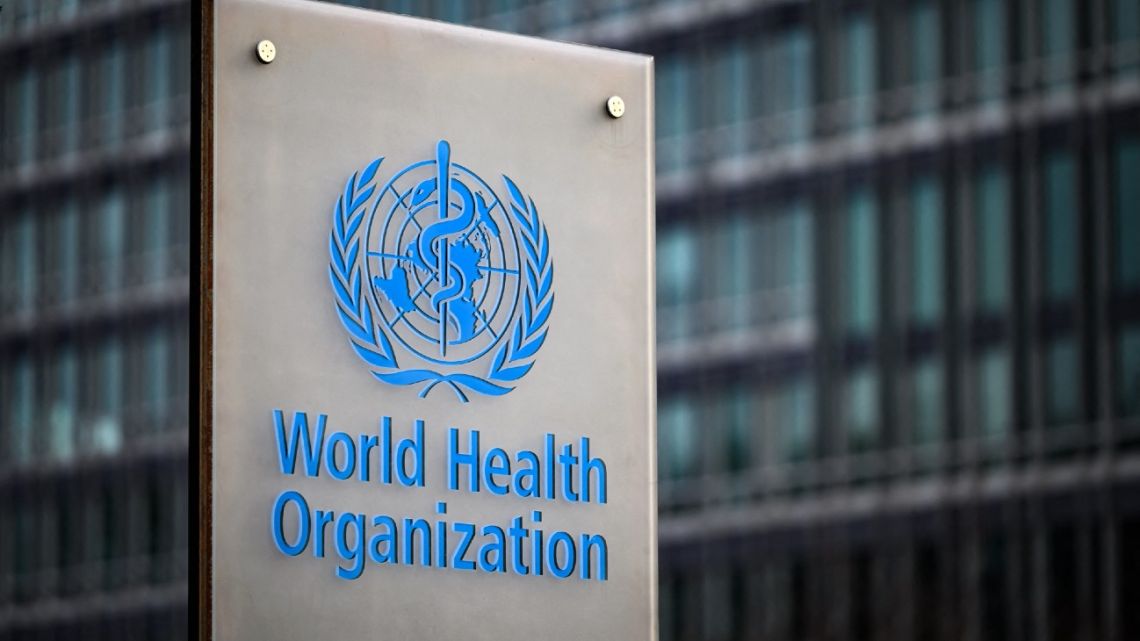 This photograph taken on December 7, 2021, shows a sign of the World Health Organisation (WHO) at its headquarters in Geneva. 