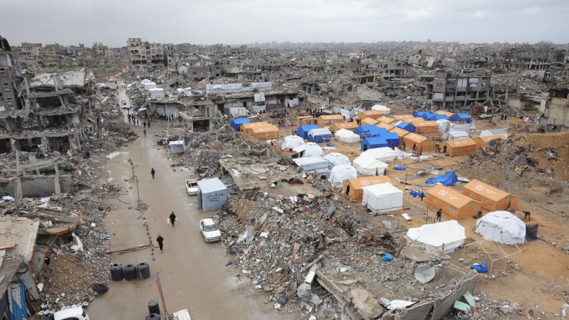 Palestinians take shelter in tents set up amid heavily damaged buildings in Jabalia in the northern Gaza Strip on February 6, 2025 during a truce in the war between Israel and Hamas.