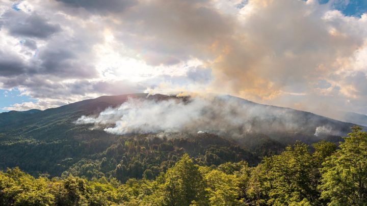 In this aerial view smoke rises above the mountains near El Bolsón, in the Patagonian province of Río Negro, Argentina, on February 4, 2025.