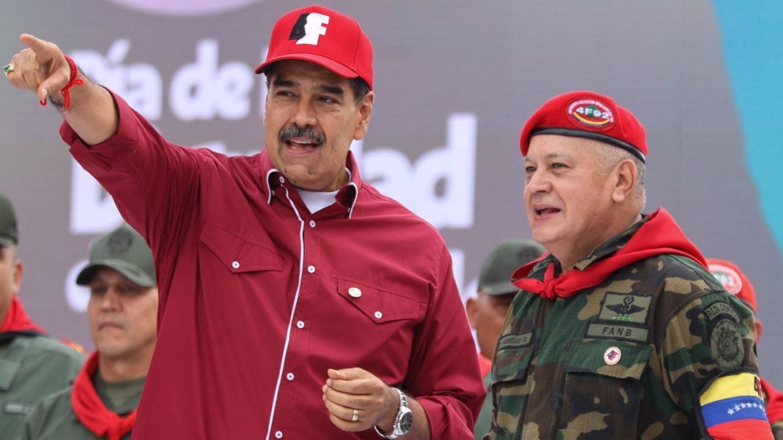 Venezuelan President Nicolás Maduro (L) and his Interior Minister Diosdado Cabello take part in a rally to commemorate the 33rd anniversary of late President Hugo Chavez's 1992 failed military coup against the government (1989-1993) of Carlos Andrés Pérez in Caracas on February 4, 2025.