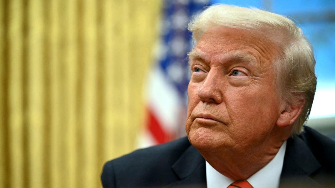 US President Donald Trump speaks to the press after signing an executive order in the Oval Office of the White House in Washington, DC, on February 10, 2025.