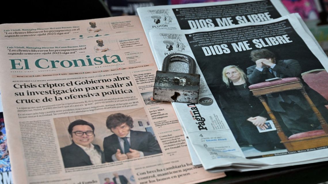 View of newspaper front pages featuring headlines of President Javier Milei after he promoted a cryptocurrency token that ended in scandal in Buenos Aires on February 17, 2025. 