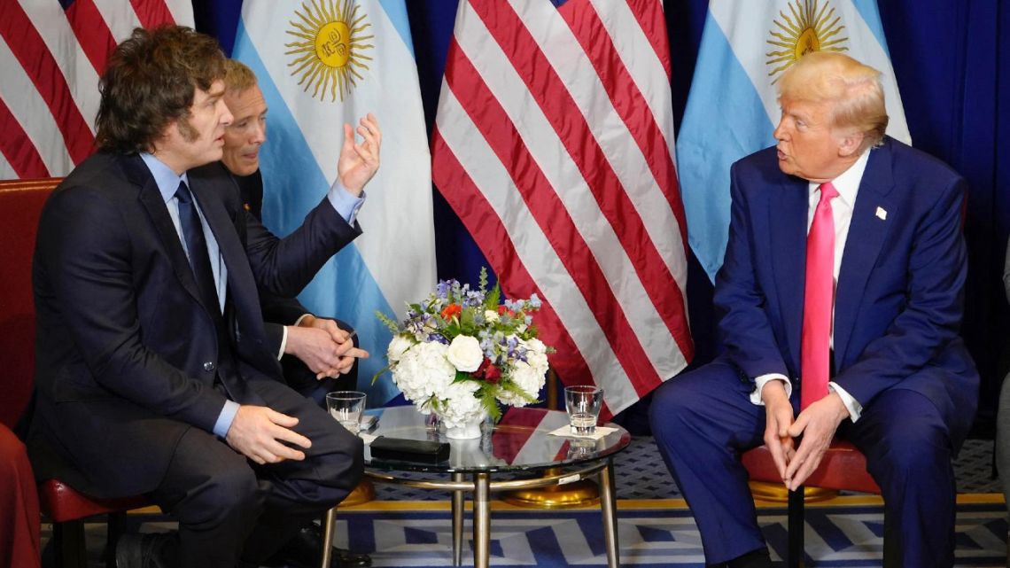 This picture released by the Presidency shows Argentina's President Javier Milei talking to US President Donald Trump during a meeting in the framework of the annual Conservative Political Action Conference (CPAC) at the Gaylord National Resort & Convention Center at National Harbor in Oxon Hill, Maryland, United States on February 22, 2025. 