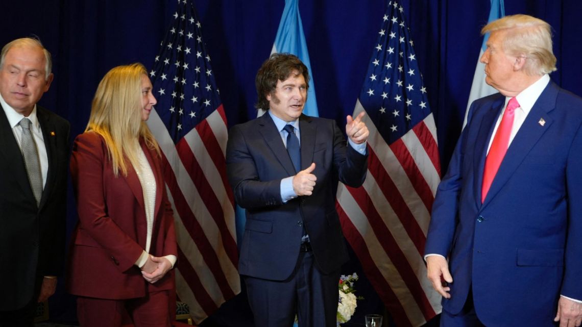 This handout picture released by the Presidency shows Argentina's President Javier Milei (centre) gesturing as he talks with US President Donald Trump (right) next to Argentina’s Presidential Chief-of-Staff Karina Milei (second left) and Argentina's Foreign Minister Gerardo Werthein (left) during a meeting in the framework of the annual Conservative Political Action Conference (CPAC) at the Gaylord National Resort & Convention Center at National Harbor in Oxon Hill, Maryland, United States on February 22, 2025. 