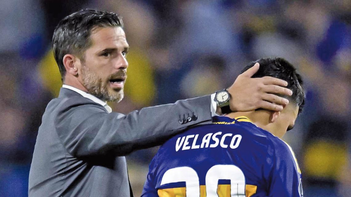 Boca Juniors coach Fernando Gago consoles his players.